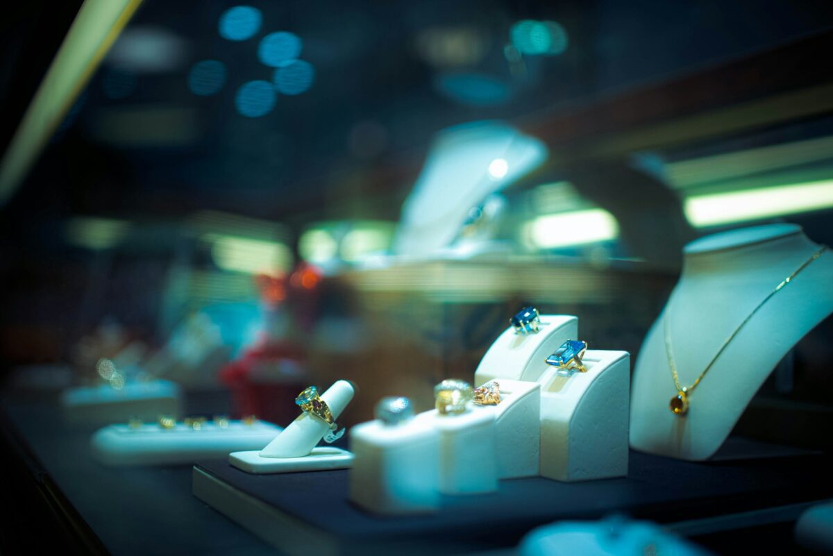 Jewellery displayed in a luxury retail showroom as UK retail pressure reaches specialist brands.