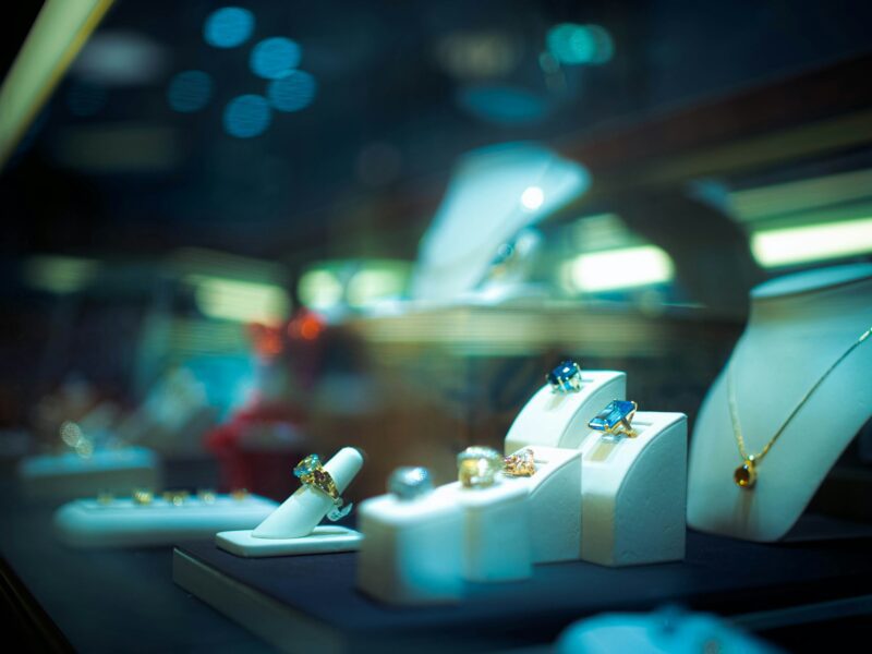 Jewellery displayed in a luxury retail showroom as UK retail pressure reaches specialist brands.