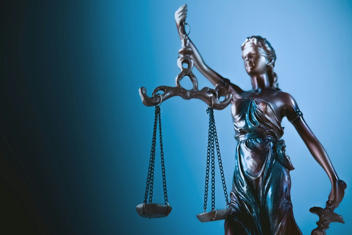 Legal symbolism for a court ruling on AI, labor rights and workplace automation.