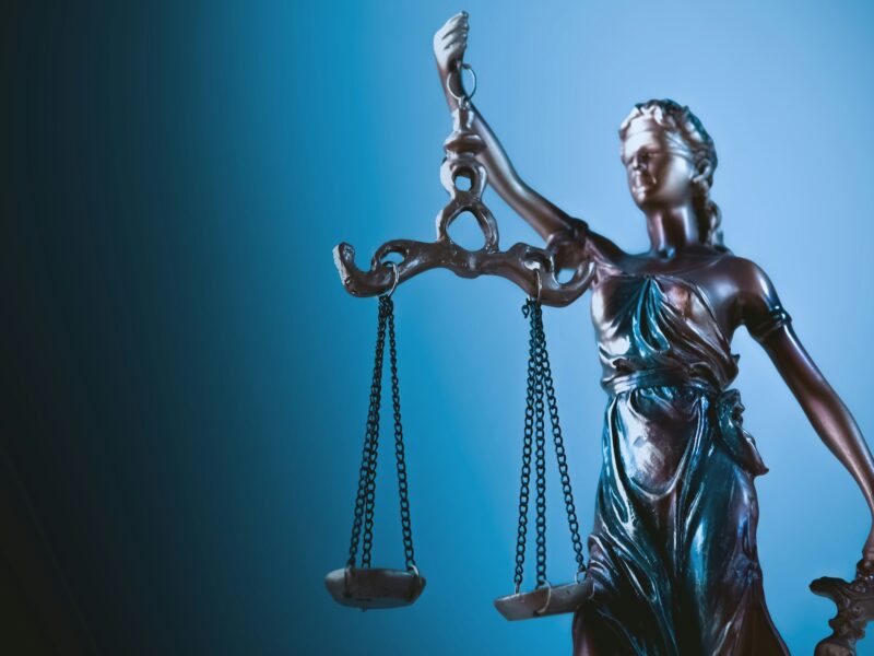 Legal symbolism for a court ruling on AI, labor rights and workplace automation.