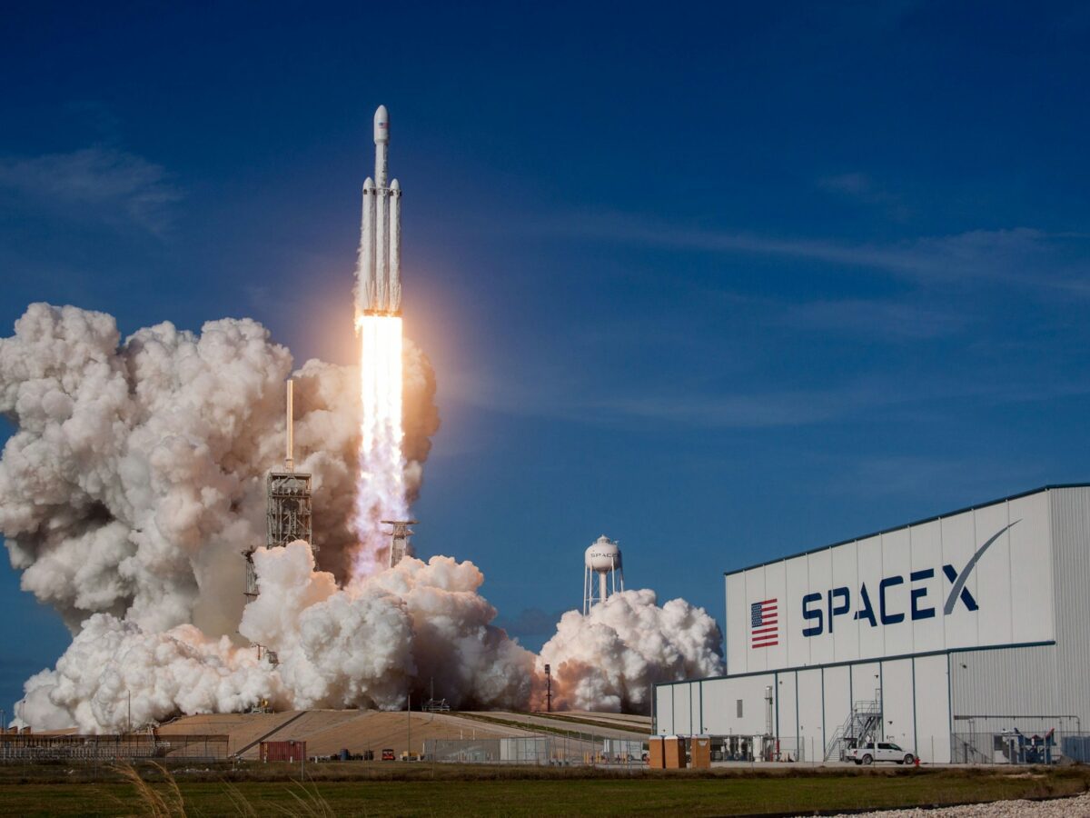 Illustration representing the growing commercial space economy and investor interest surrounding SpaceX’s potential public market debut.