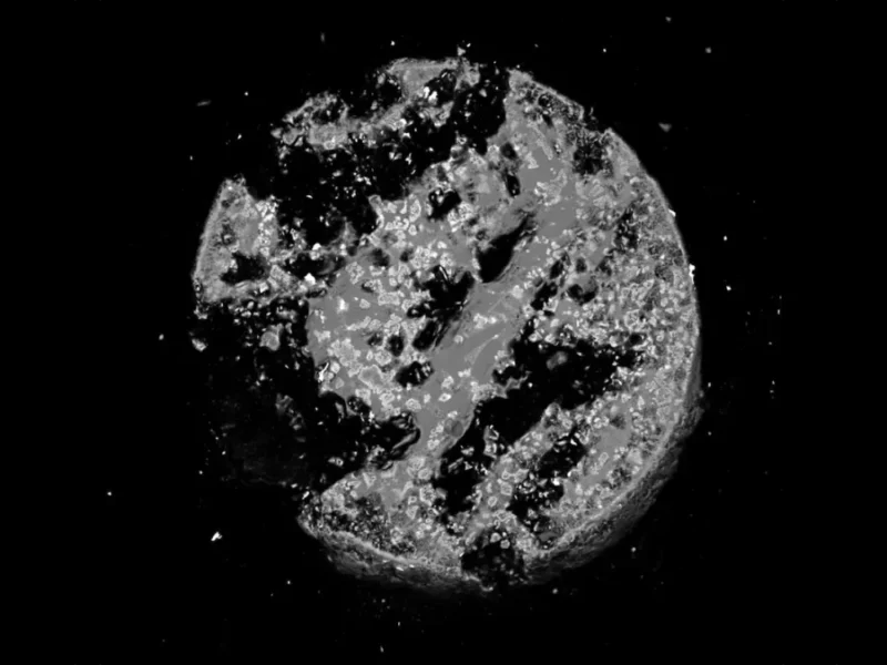 Unknown Alloy Found Inside Glass Formed by the Hiroshima Atomic Bomb