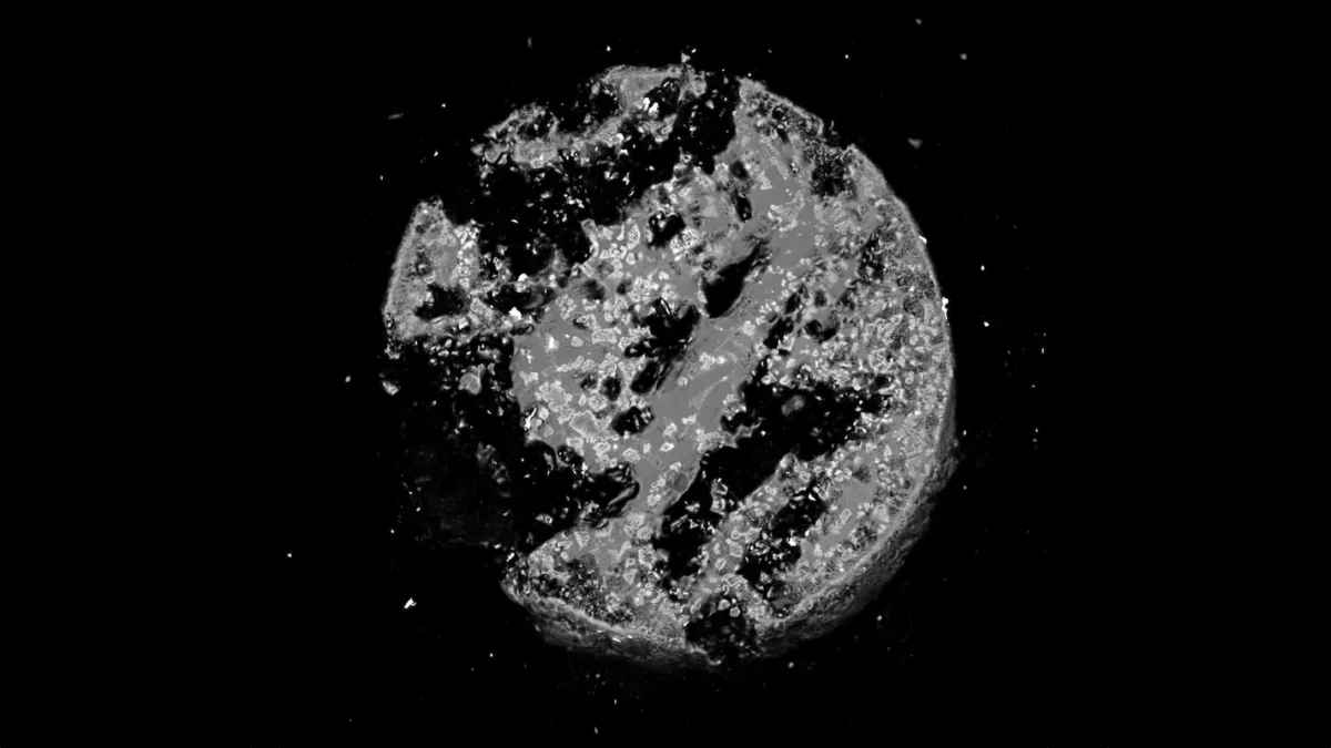 Unknown Alloy Found Inside Glass Formed by the Hiroshima Atomic Bomb